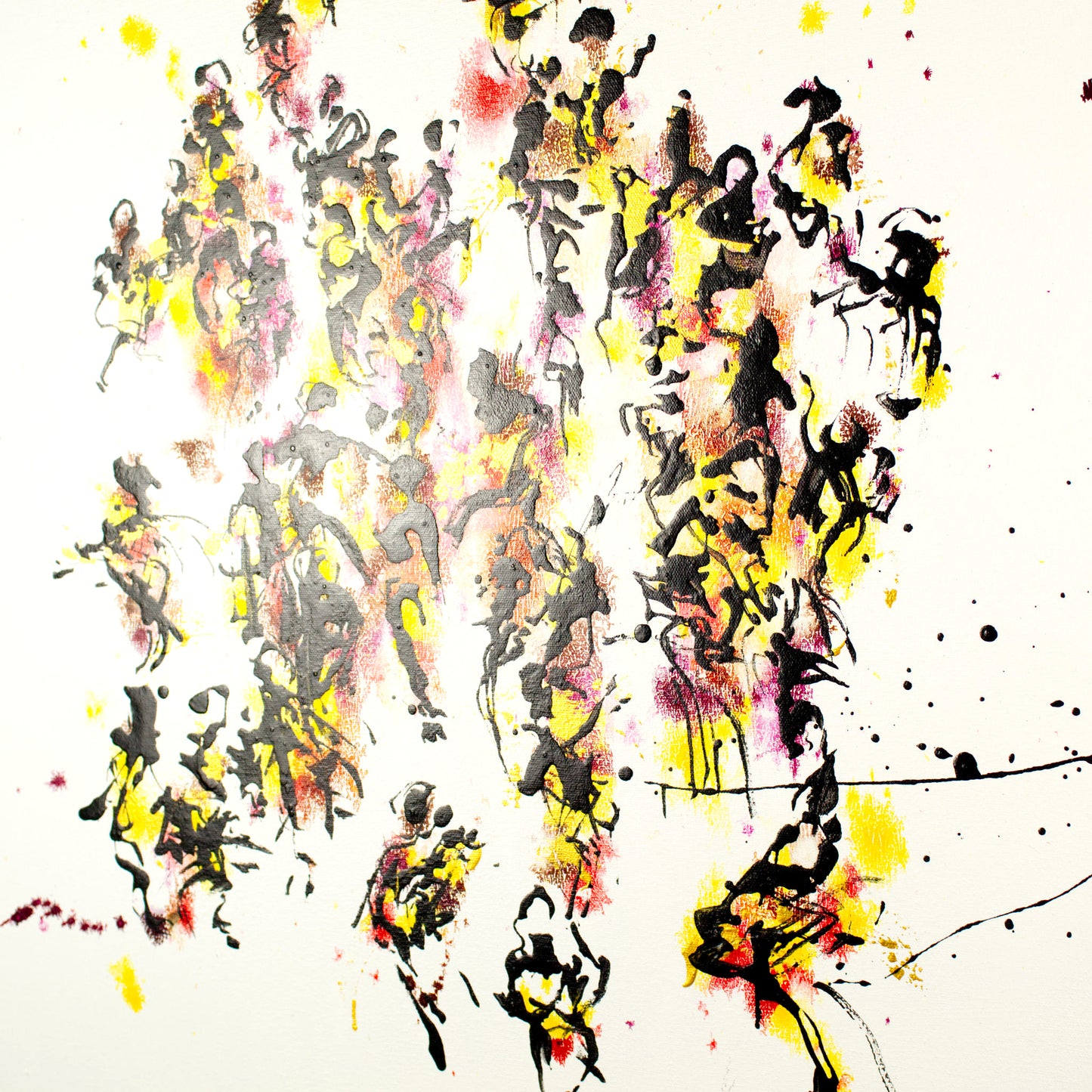 Abstract art with splashes of gold, yellow, black, and red on a pristine white background