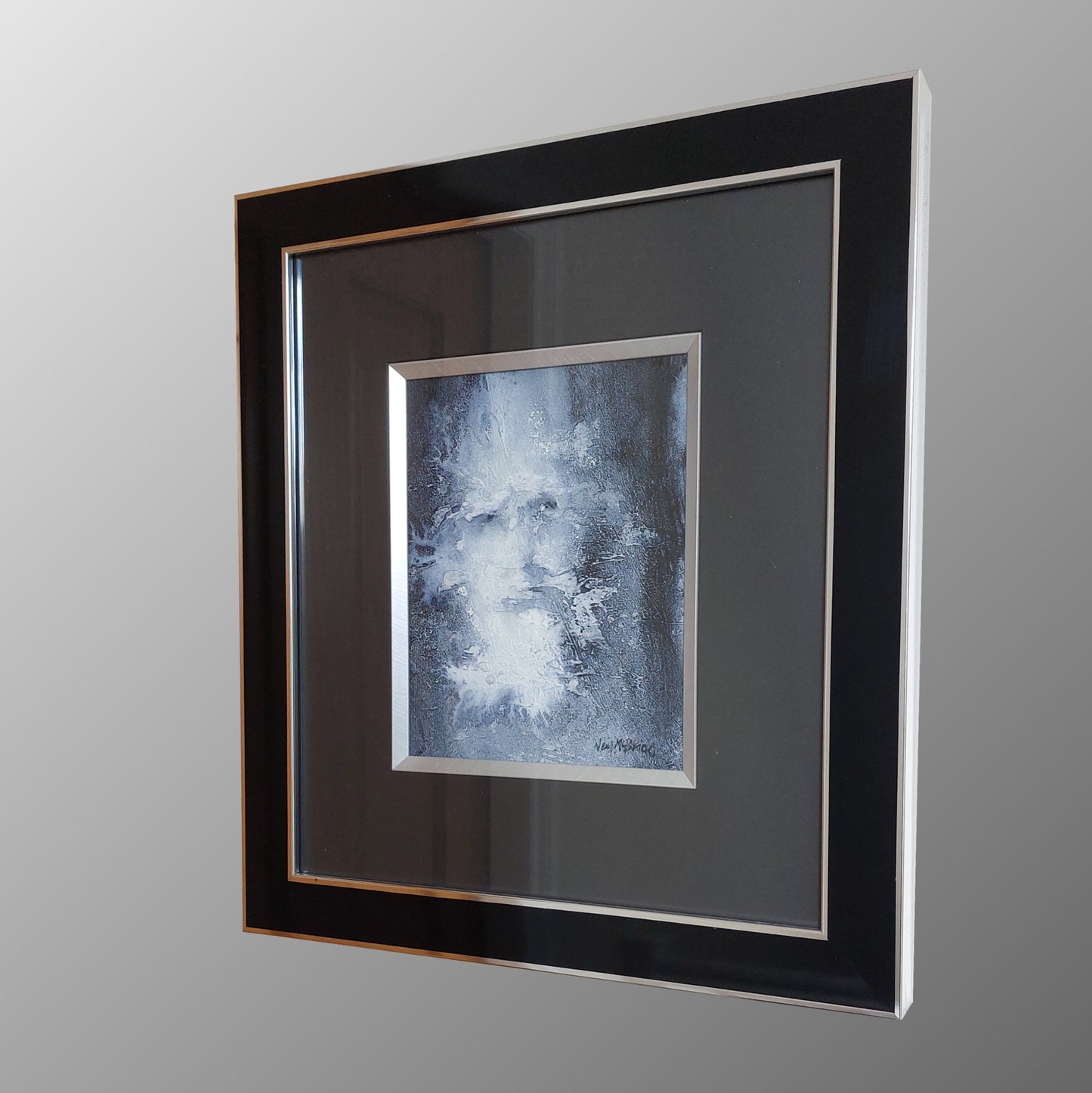 Framed wall art featuring an abstract portrait painting in blue, white, and grey tones, set within a black frame with a wide dark mat and a thin metallic inner border. © Neil McBride 2026