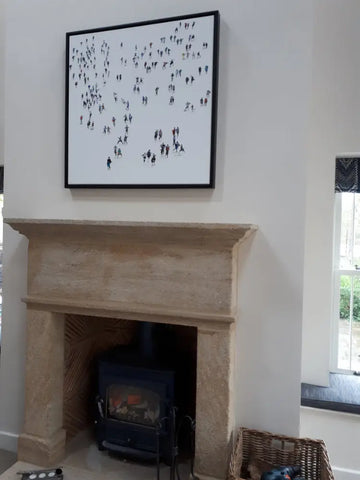 This elegant black and white painting of a crowd of people fits perfectly with this interior which is a blend of traditional and contemporary fixtures..