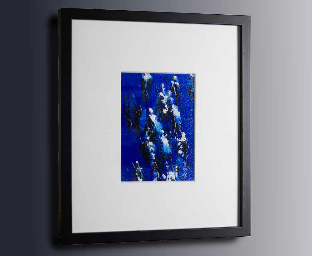Racing - a small original painting framed in a black frame with white mount by Neil McBride